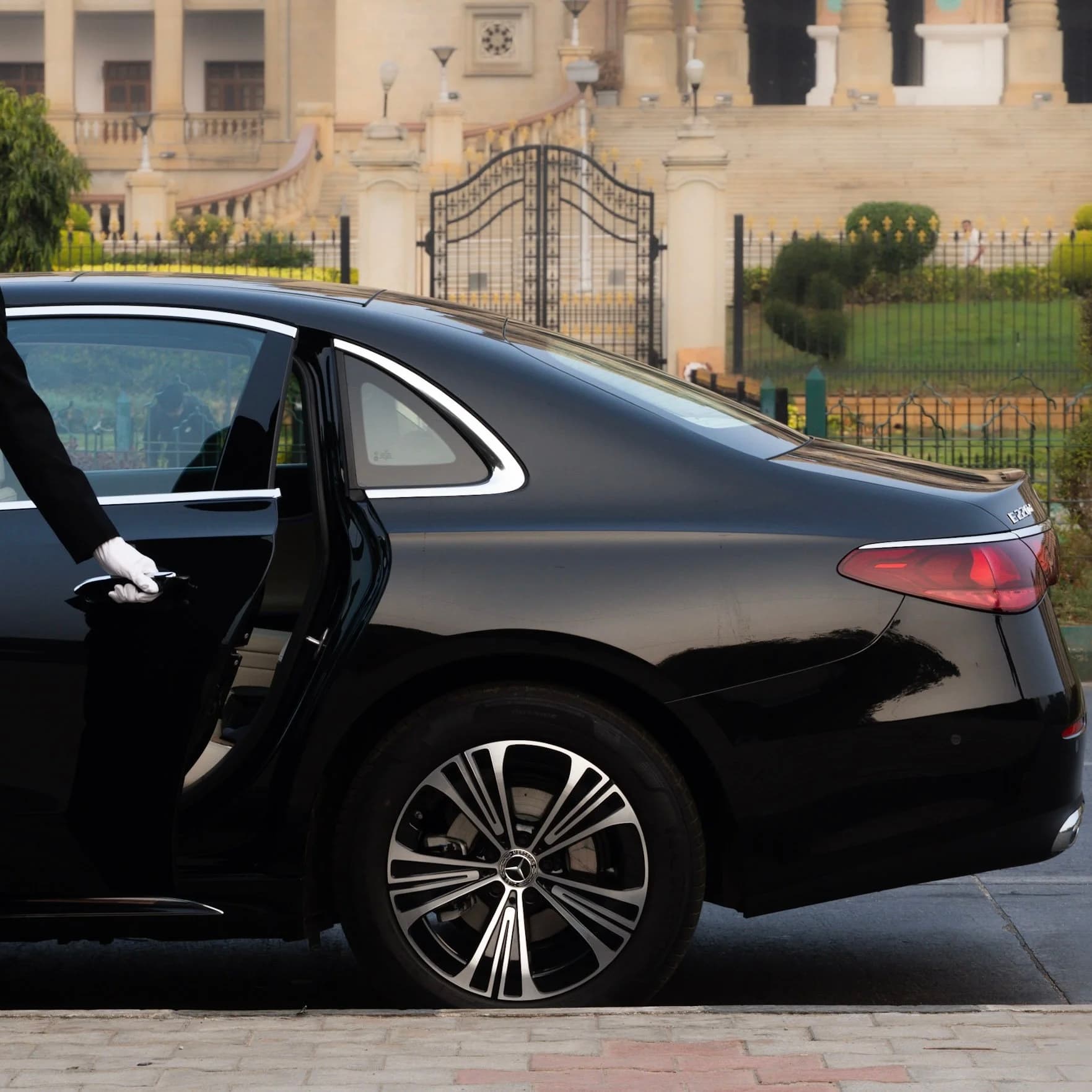 Chauffeur driven luxury car for hire in Bangalore — white glove door service