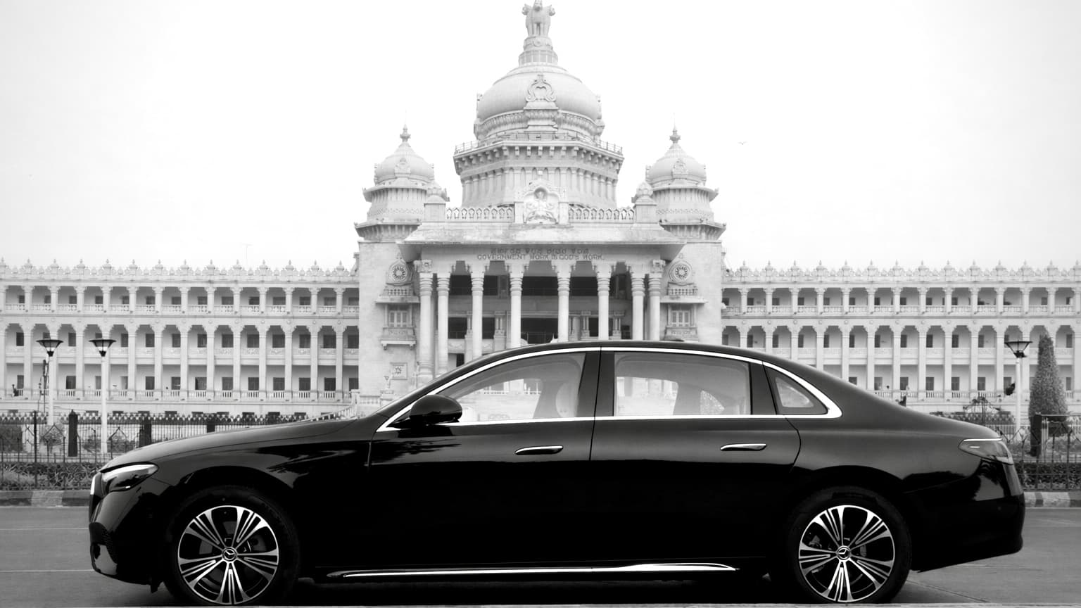 Arista chauffeur-driven luxury sedan in front of Vidhana Soudha, Bangalore